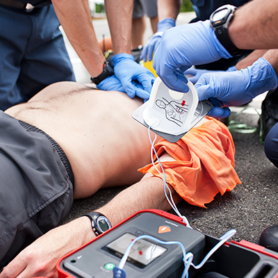 HeartStart FR3 AED being used by healthcare professionals for sudden cardiac arrest.